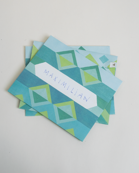 Set of three letterfolds featuring a blue jacquard design, displayed together in a stacked spread.