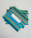 Set of three letterfolds featuring a green stripes design, displayed together in a stacked spread.