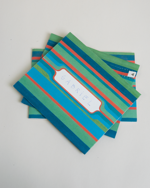Set of three letterfolds featuring a green stripes design, displayed together in a stacked spread.