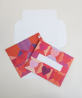 Three hearts design letterfolds showing the front, back, and interior views of the design