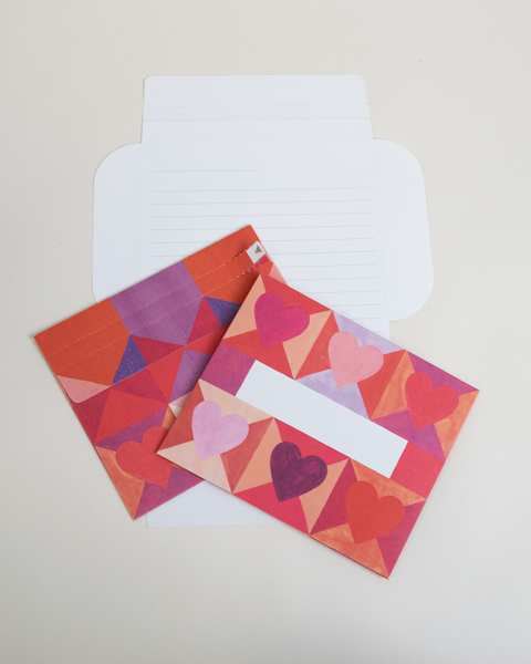 Three hearts design letterfolds showing the front, back, and interior views of the design