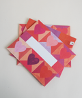 Set of three letterfolds featuring a hearts design, displayed together in a stacked spread.