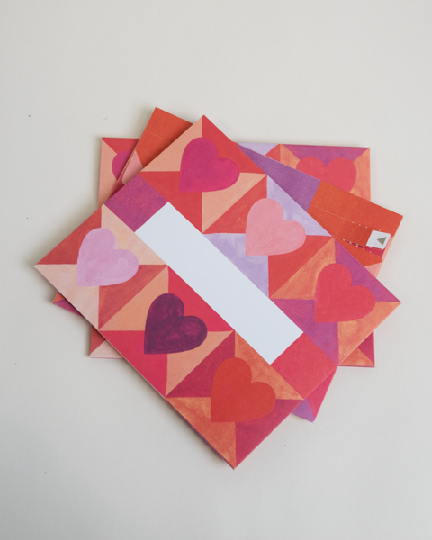 Set of three letterfolds featuring a hearts design, displayed together in a stacked spread.