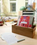 Three hearts design letterfolds and an open letterfold arranged in a stylish stationery desk setting.