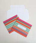 Three pink stripes letterfolds showing the front, back, and interior views of the design