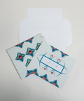 Three turquoise floral letterfolds showing the front, back, and interior views of the design