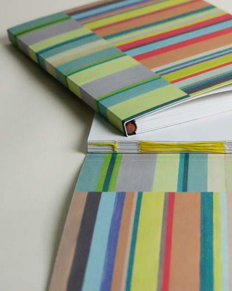 Eco-friendly notebook both side  stripes design, DIN A5 recycled paper cover, zoom in handbound detail, handmade in Berlin