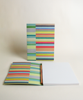 A5 notebook featuring a colorful both side stripes design, shown from the front and open to reveal its interior.