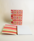 A5 notebook featuring a colorful Stained-glass flowers and stripes design, shown from the front and open to reveal its interior.