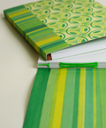 Eco-friendly notebook Stained-glass flowers and stripes design, DIN A5 recycled paper cover, zoom in handbound detai, handmade in Berlin