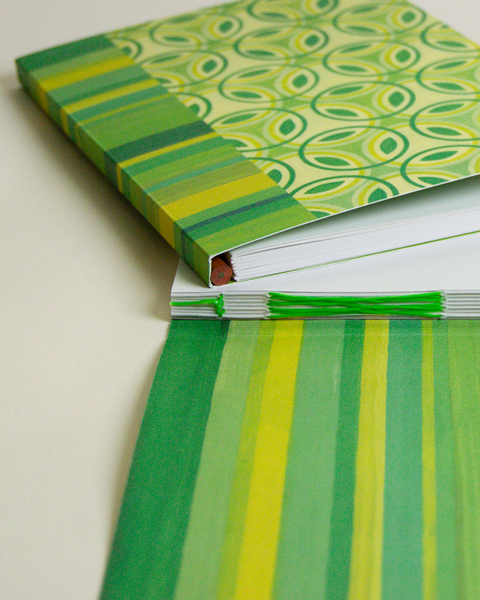 Eco-friendly notebook Stained-glass flowers and stripes design, DIN A5 recycled paper cover, zoom in handbound detai, handmade in Berlin