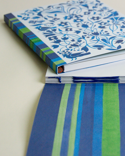Eco-friendly notebook garden and stripes in blue design, DIN A5 recycled paper cover, zoom in handbound detail, handmade in Berlin