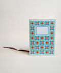 A5 notebook featuring a delicate lilac floral design, shown from the front and open to reveal its interior.