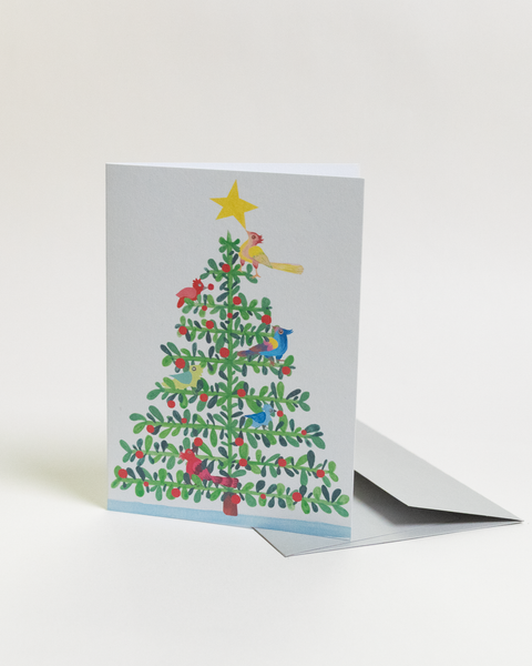 Eco-friendly Christmas in paradise-Tree design  greeting card, angled view, printed in Berlin on recycled paper.