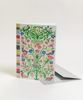 Eco-friendly Circles & Stripes in color design greeting card, angled view, printed in Berlin on recycled paper.