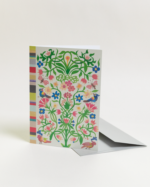 Eco-friendly Circles & Stripes in color design greeting card, angled view, printed in Berlin on recycled paper.