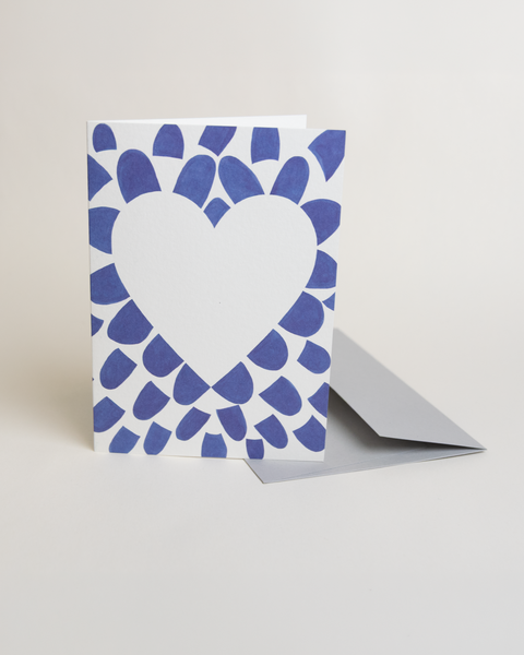Eco-friendly lovely on blue petals greeting card, 3/4 angled view, printed in Berlin on recycled paper
