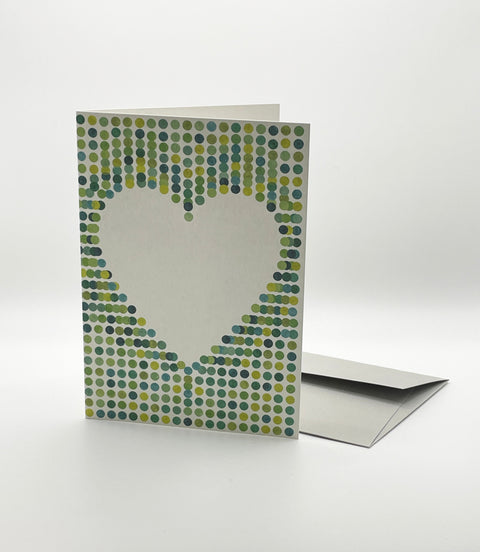 Eco-friendly lovely on green spots greeting card, 3/4 angled view, printed in Berlin on recycled paper