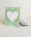 Eco-friendly lovely on green spots greeting card, 3/4 angled view, printed in Berlin on recycled paper