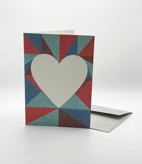 Eco-friendly lovely on triangles greeting card, 3/4 angled view, printed in Berlin on recycled paper