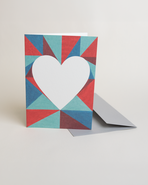 Eco-friendly lovely on triangles greeting card, 3/4 angled view, printed in Berlin on recycled paper