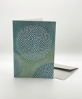 Eco-friendly No Pre-text in blue greeting card, 3/4 angled view, printed in Berlin on recycled paper