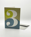 Eco-friendly number 3 greeting card, 3/4 angled view, printed in Berlin on recycled paper