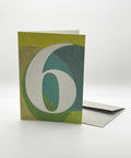 Eco-friendly number 6 greeting card, 3/4 angled view, printed in Berlin on recycled paper
