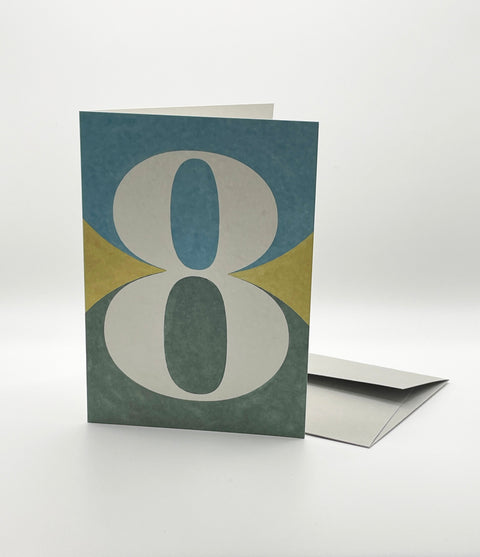 Eco-friendly number 8 greeting card, 3/4 angled view, printed in Berlin on recycled paper