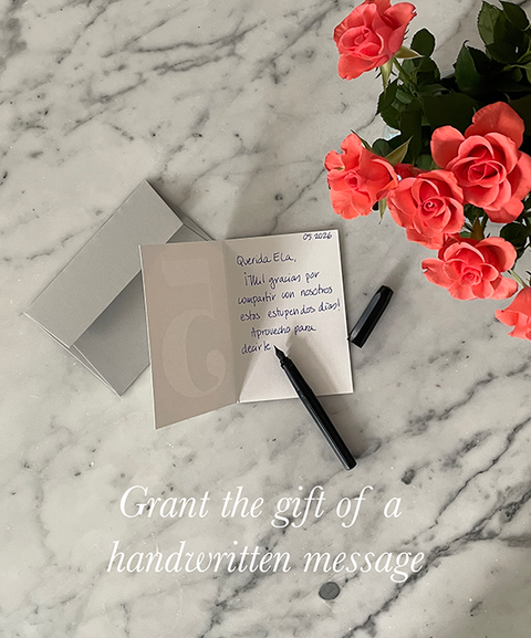 Greeting card open with handwritten message on grey envelope, decorated with flowers – eco stationery handmade in Berlin.