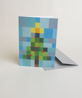 Eco-friendly X-mas tree in squares snow greeting card, 3/4 angled view, printed in Berlin on recycled paper
