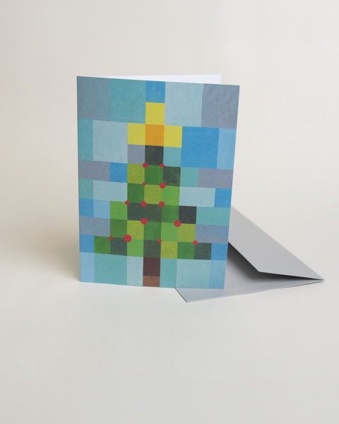 Eco-friendly X-mas tree in squares snow greeting card, 3/4 angled view, printed in Berlin on recycled paper