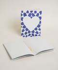 Eco-friendly notebook Lovely on blue petals, angled view, DIN A6 recycled paper cover, handmade in Berlin