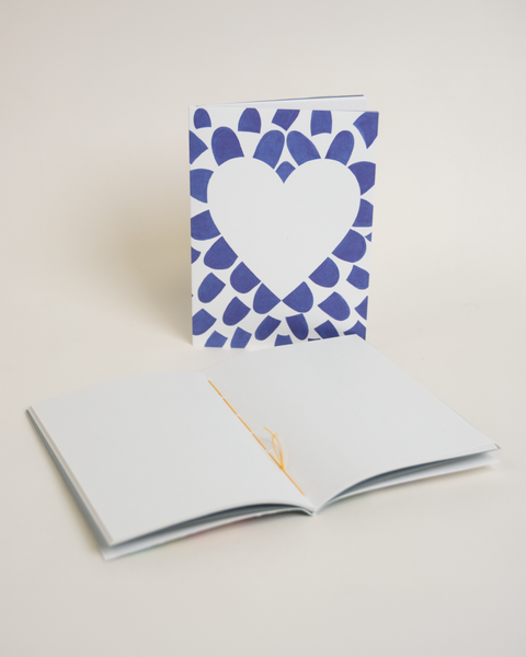 Eco-friendly notebook Lovely on blue petals, angled view, DIN A6 recycled paper cover, handmade in Berlin
