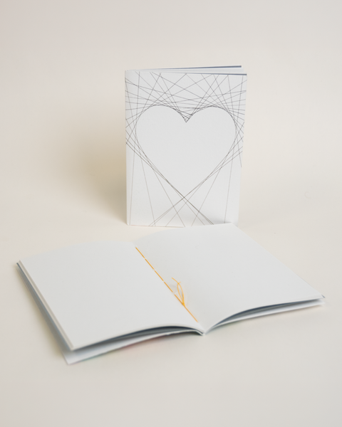 Eco-friendly notebook Lovely on lines, angled view, DIN A6 recycled paper cover, handmade in Berlin