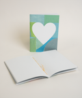 Eco-friendly notebook Lovely on mints+, angled view, DIN A6 recycled paper cover, handmade in Berlin
