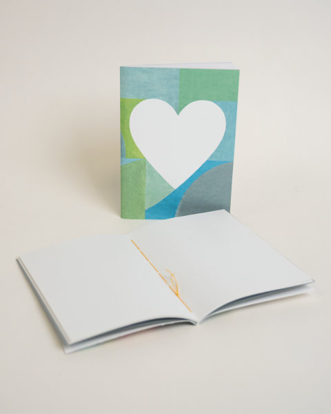 Eco-friendly notebook Lovely on mints+, angled view, DIN A6 recycled paper cover, handmade in Berlin