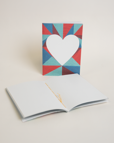 Eco-friendly notebook Lovely on triangles, angled view, DIN A6 recycled paper cover, handmade in Berlin