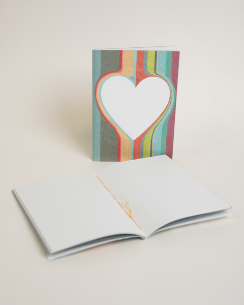 Eco-friendly notebook Lovely on stripes, angled view, DIN A6 recycled paper cover, handmade in Berlin