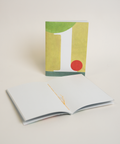 Eco-friendly notebook number 1, angled view, DIN A6 recycled paper cover, handmade in Berlin