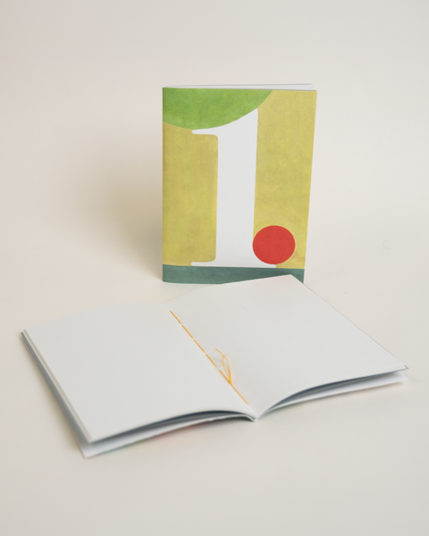 Eco-friendly notebook number 1, angled view, DIN A6 recycled paper cover, handmade in Berlin