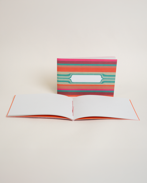 Eco-friendly notebook Mexican Stripes, angled view, DIN A6 recycled paper cover, handmade in Berlin
