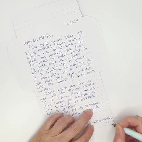 Video of Mexican stripes letterfold being folded into an envelope, eco stationery