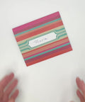 Video of Mexican stripes letterfold being opened to reveal inside, handmade stationery