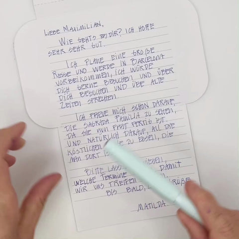 Video of Blue jacquard letterfold being folded into an envelope, eco stationery