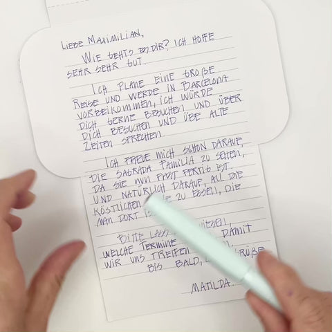 Video of Blue jacquard letterfold being folded into an envelope, eco stationery
